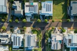 An aeriel view of houses with solar panels installed